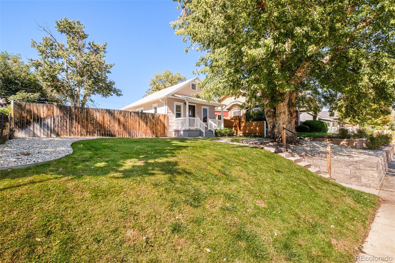 4635 Elm Court Denver, CO 80211 - Photo 28 of 28 a view of a house with a yard