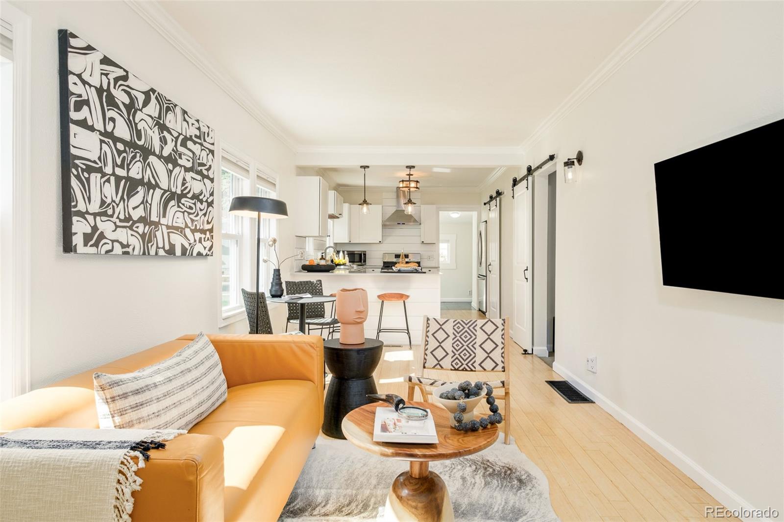 4635 Elm Court Denver, CO 80211 - Photo 9 of 28 a living room with furniture and a flat screen tv
