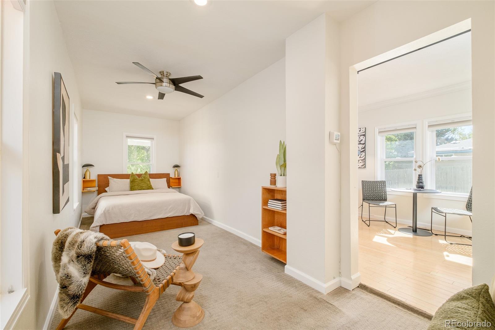 4635 Elm Court Denver, CO 80211 - Photo 10 of 28 a bedroom with furniture and a wooden floor