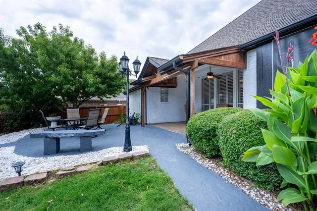 a front view of house with yard and outdoor seating