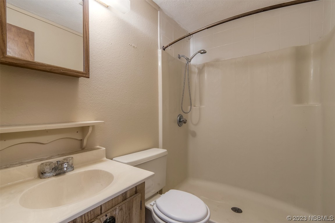 209 Pine Avenue Edgewater, FL 32141 - Photo 20 of 34 a bathroom with a sink toilet and shower