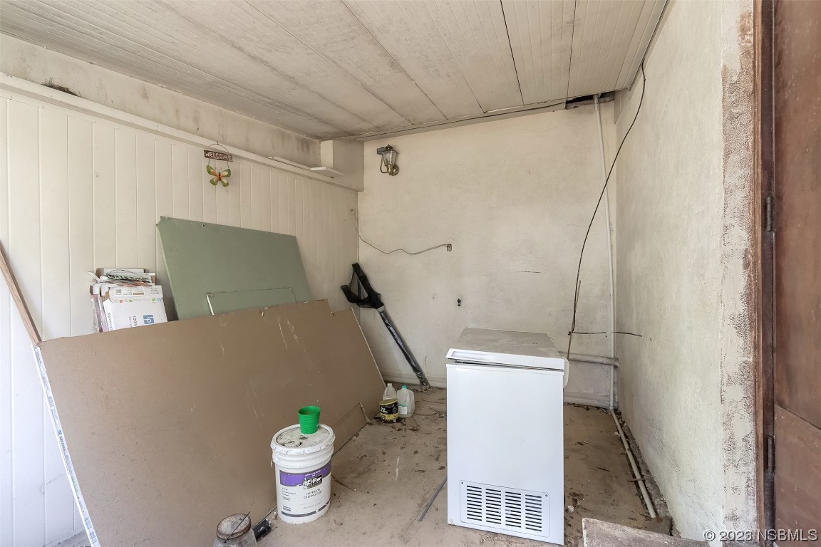 209 Pine Avenue Edgewater, FL 32141 - Photo 21 of 34 a floor to a dining room with a table and a potted plant