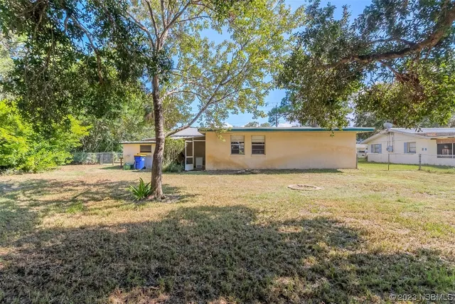 a backyard of a house with lots of green space