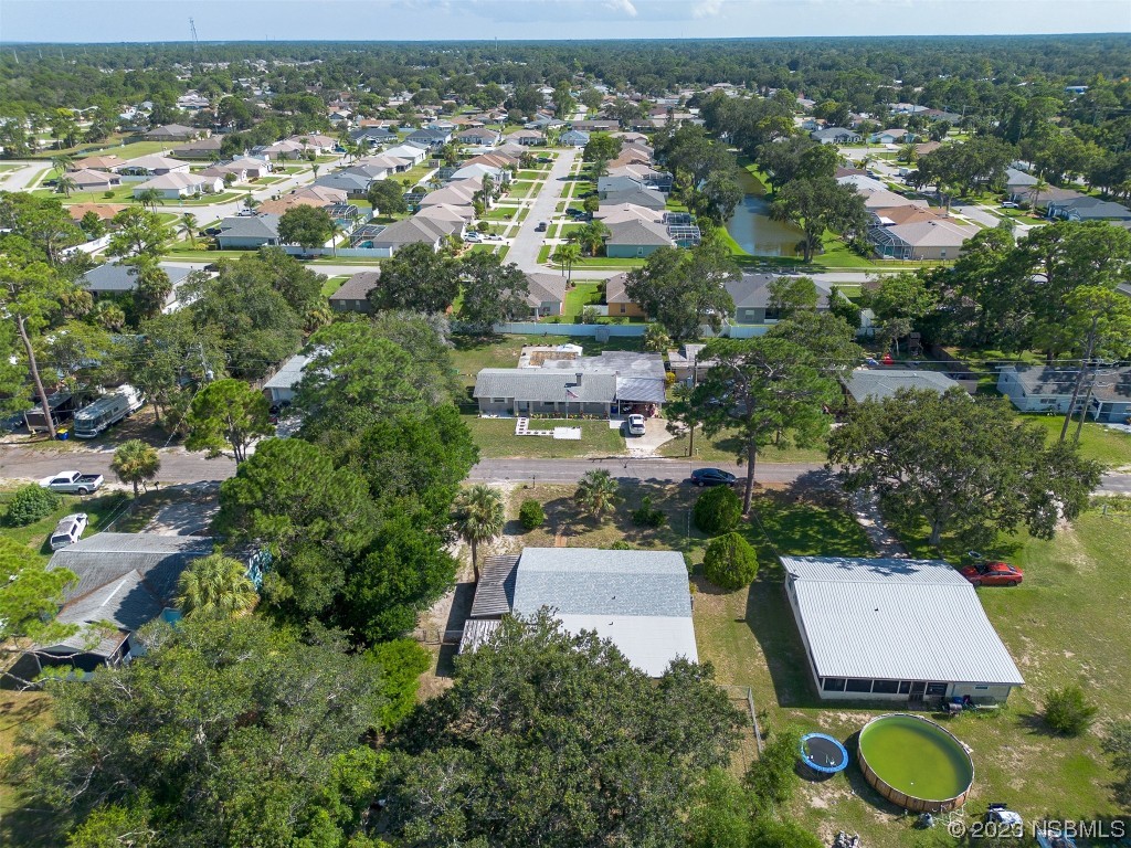 209 Pine Avenue Edgewater, FL 32141 - Photo 30 of 34 an aerial view of residential houses with outdoor space and trees