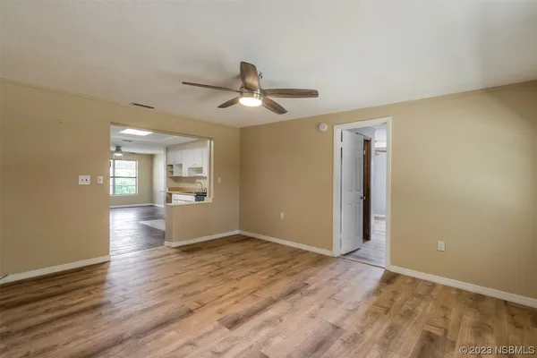 a view of an empty room with a window