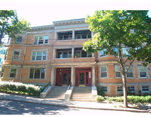 88 Naples Road, Unit 1 88 Brookline, MA 02446 - Photo 1 of 1 a front view of a residential apartment building with a yard