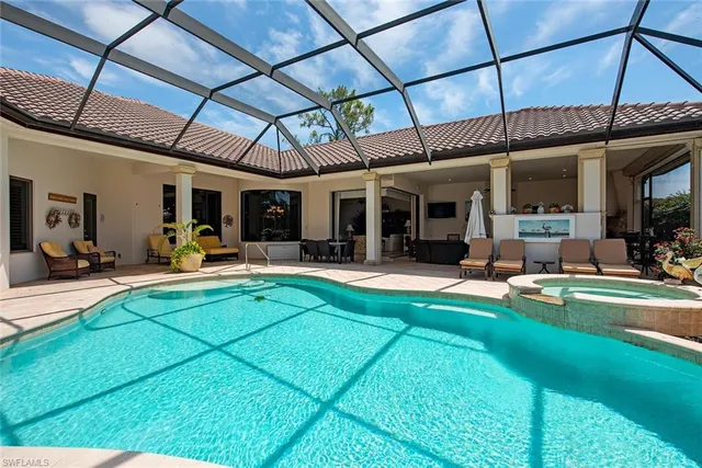 a view of a swimming pool with a patio