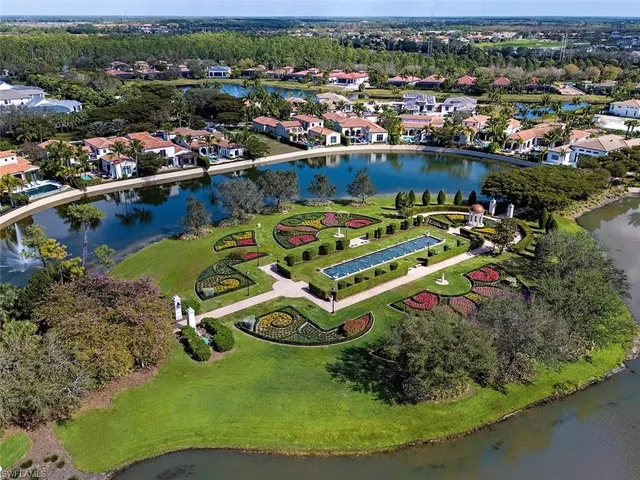 an aerial view of a house with a lake view