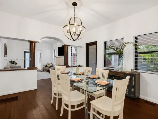 a kitchen with stainless steel appliances a sink counter space and wooden floor
