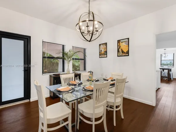 a room that has a window and a table in it