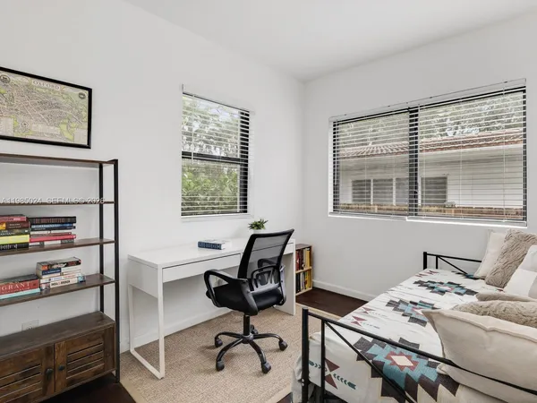 a room with a bed and a table
