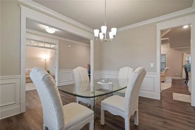 a view of a livingroom with furniture and wooden floor