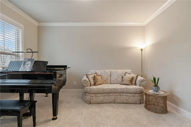 a bathroom with a granite countertop sink vanity mirror and toilet