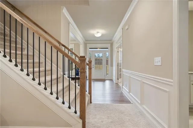 a living room with furniture a ceiling fan and a window