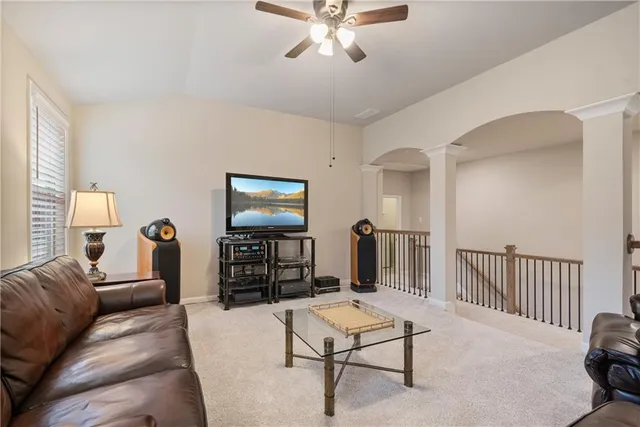 a view of walk in closet with clothes