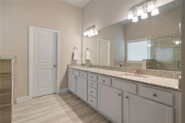 a bedroom with a bed and a lamp