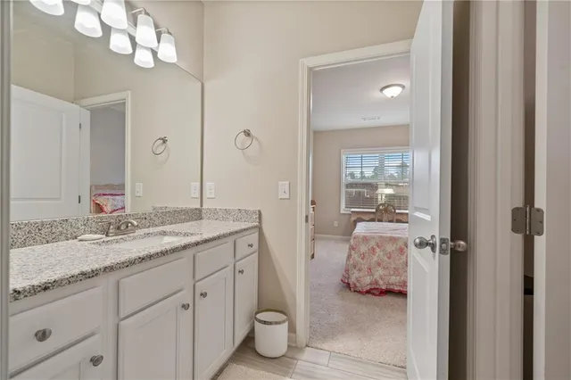 a view of a livingroom with furniture and a window