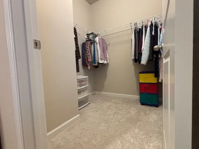 a view of house with yard and deck