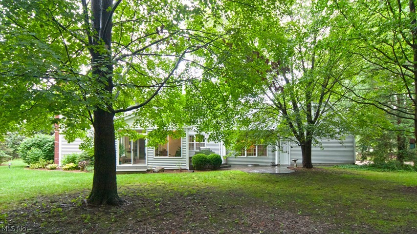 15210 Darrow Road Vermilion, OH 44089 - Photo 31 of 35 Back of the home. Stamped patio and Sunroom!