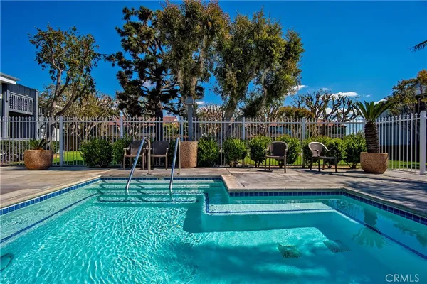 a view of a swimming pool with a patio