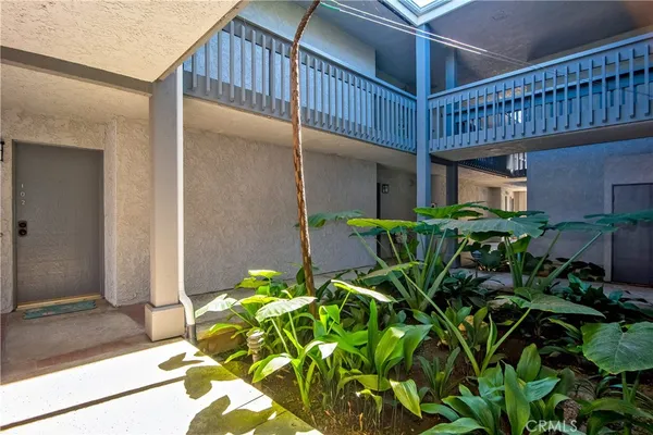 a view of entryway with flower pots