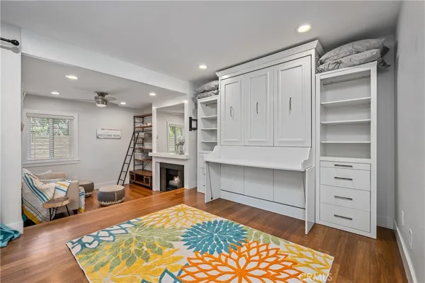 a room with furniture and a wooden floor
