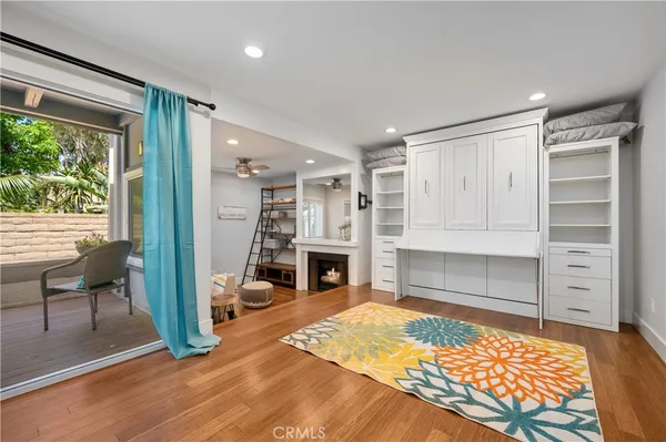 a bedroom with furniture and a fireplace