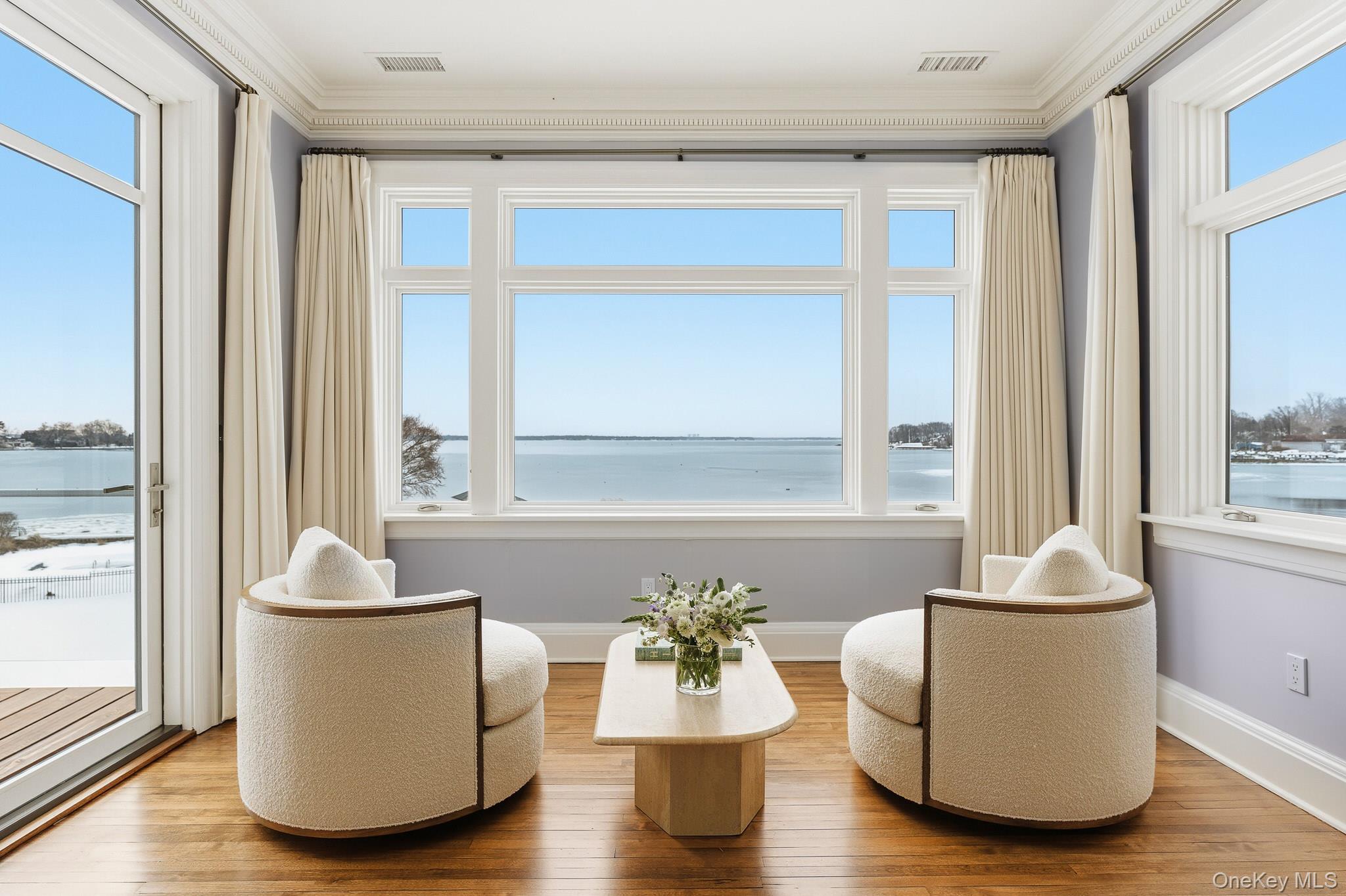 217 Hommocks Road Larchmont, NY 10538 - Photo 20 of 49 a living room with couches and a potted plant