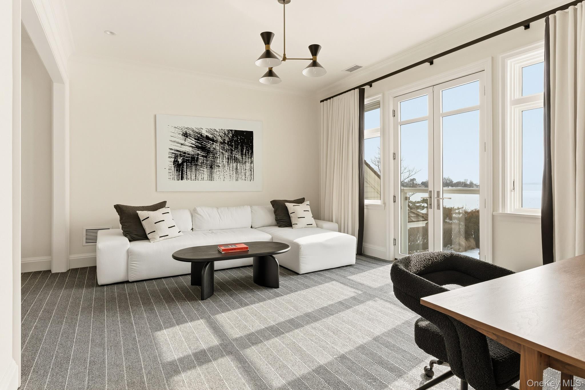 217 Hommocks Road Larchmont, NY 10538 - Photo 27 of 49 a living room with furniture and a large window