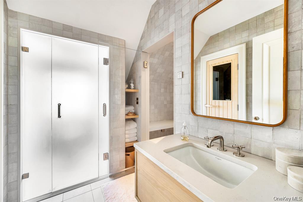 217 Hommocks Road Larchmont, NY 10538 - Photo 30 of 49 a bathroom with a sink and a mirror