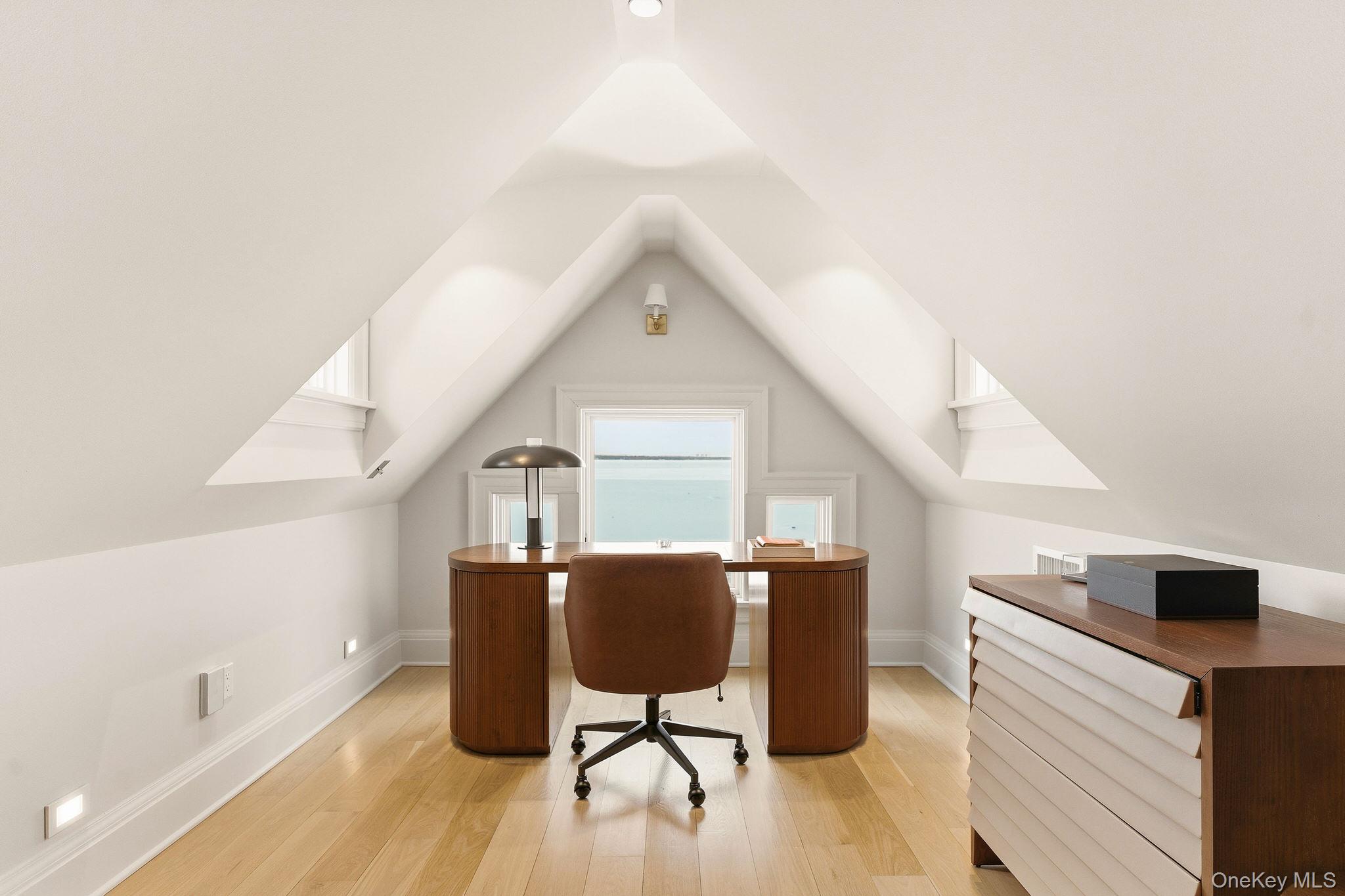 217 Hommocks Road Larchmont, NY 10538 - Photo 32 of 49 a view of workspace with wooden floor and windows