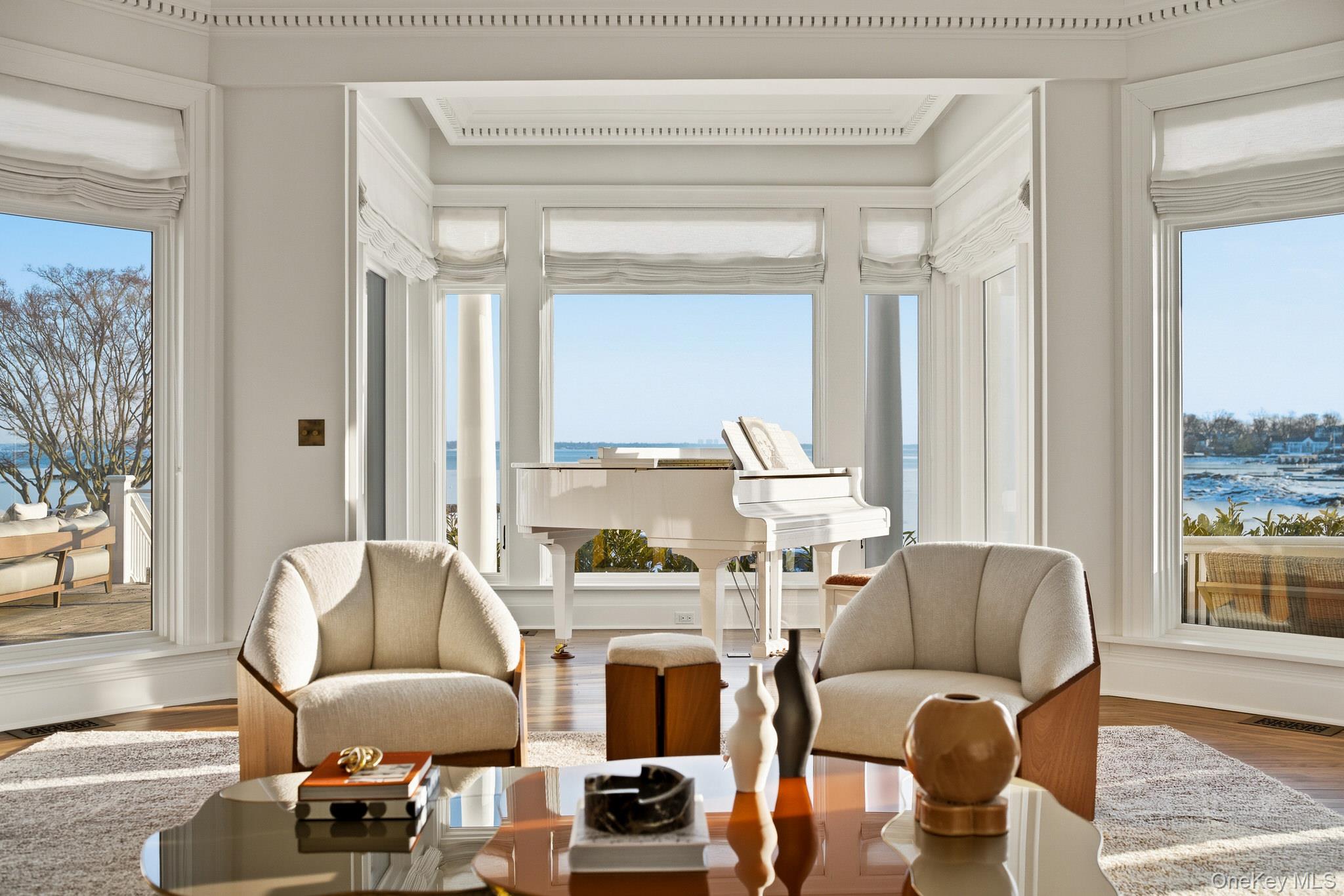 217 Hommocks Road Larchmont, NY 10538 - Photo 8 of 49 a living room with furniture and a large window