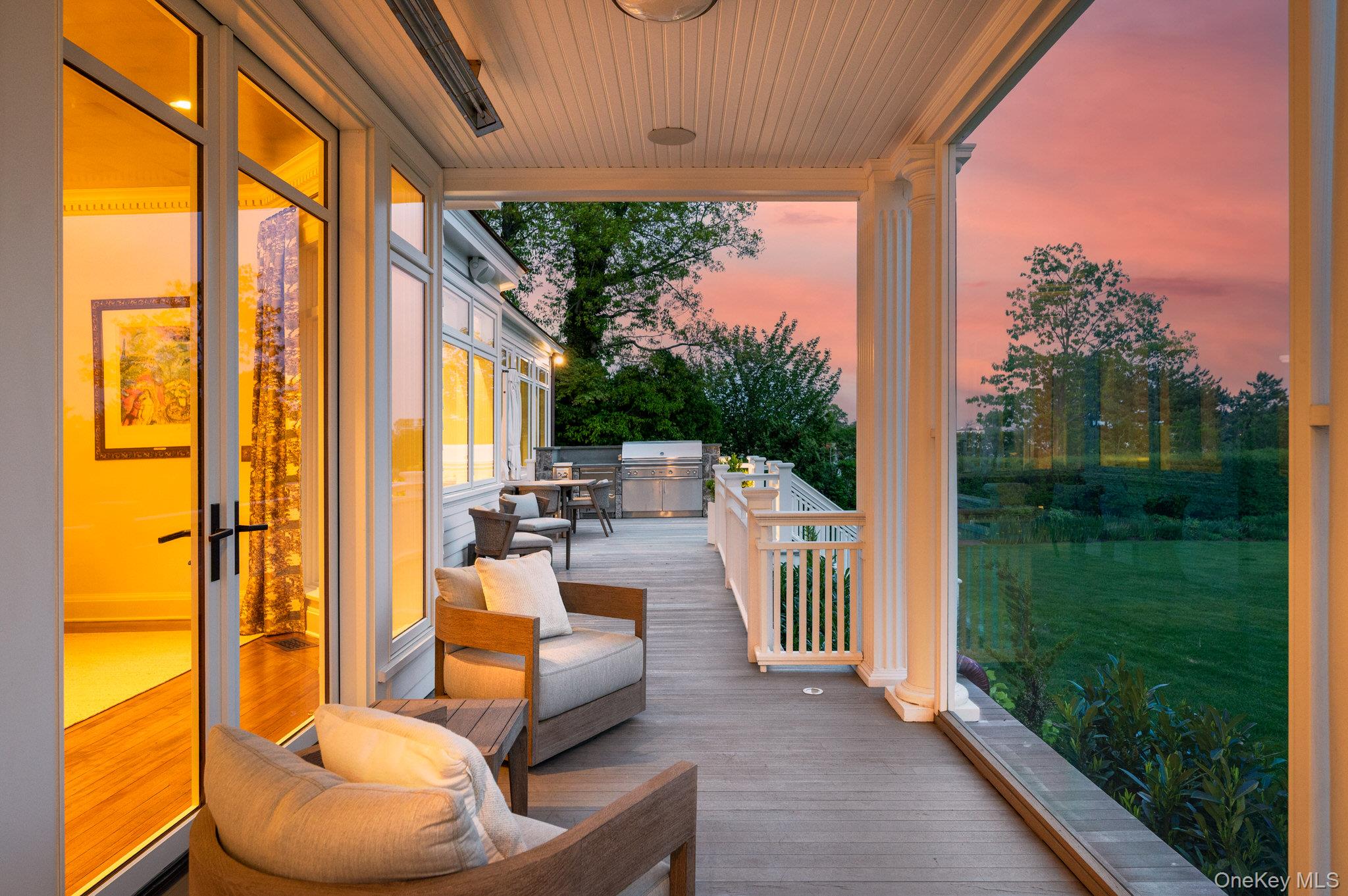 217 Hommocks Road Larchmont, NY 10538 - Photo 10 of 49 a balcony with furniture and a garden