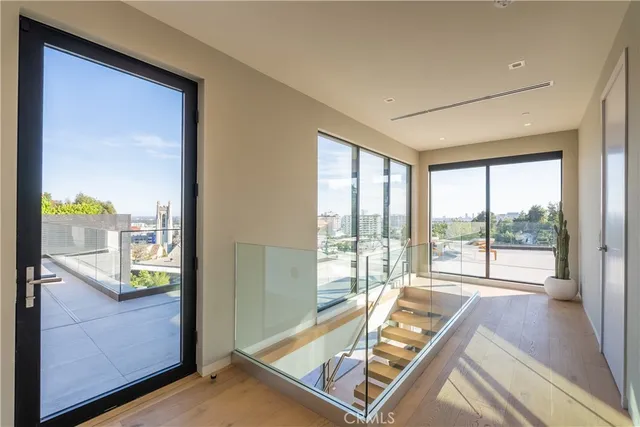 a bedroom with a large bed and a large window