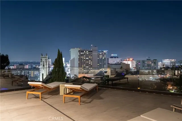 a bedroom with a bed lamp and window