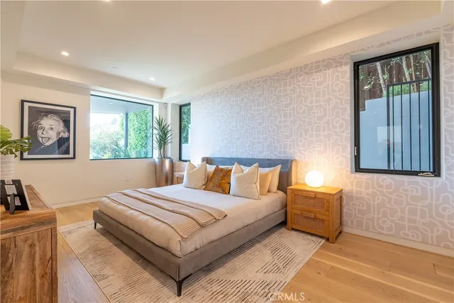 a bedroom with a bed and a lamp