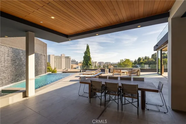 a kitchen with a dining table chairs and window