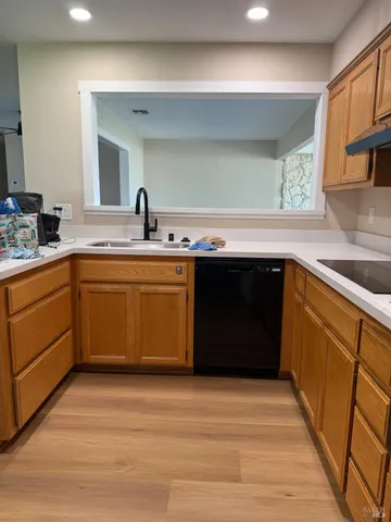 a kitchen with a sink and cabinets