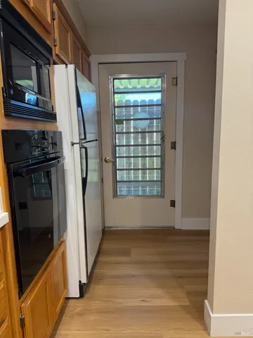 a view of empty room with front door