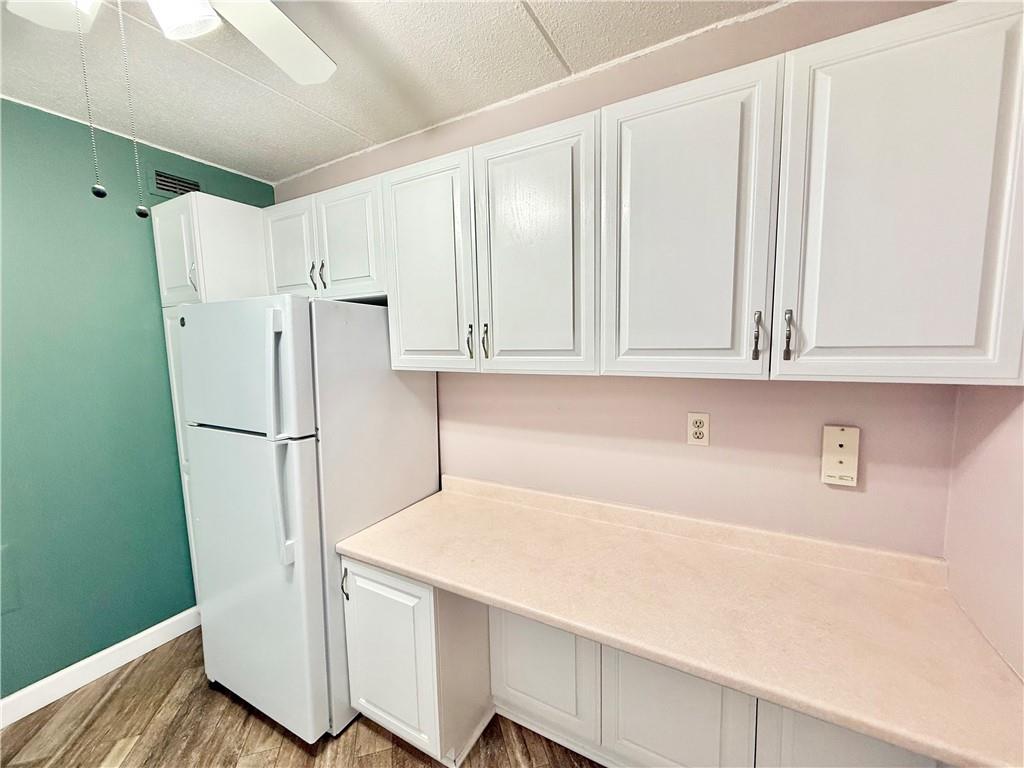 1160 Bower Hill Road, Unit 302C Mt. Lebanon, PA 15243 - Photo 16 of 39 a white refrigerator freezer sitting inside of a kitchen