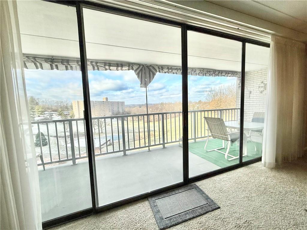 1160 Bower Hill Road, Unit 302C Mt. Lebanon, PA 15243 - Photo 17 of 39 a view of a large window with an outdoor space