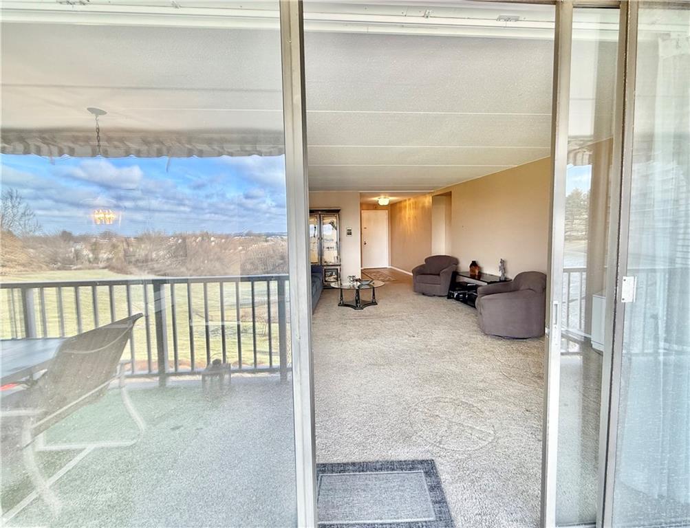 1160 Bower Hill Road, Unit 302C Mt. Lebanon, PA 15243 - Photo 18 of 39 a view of a living room and a balcony