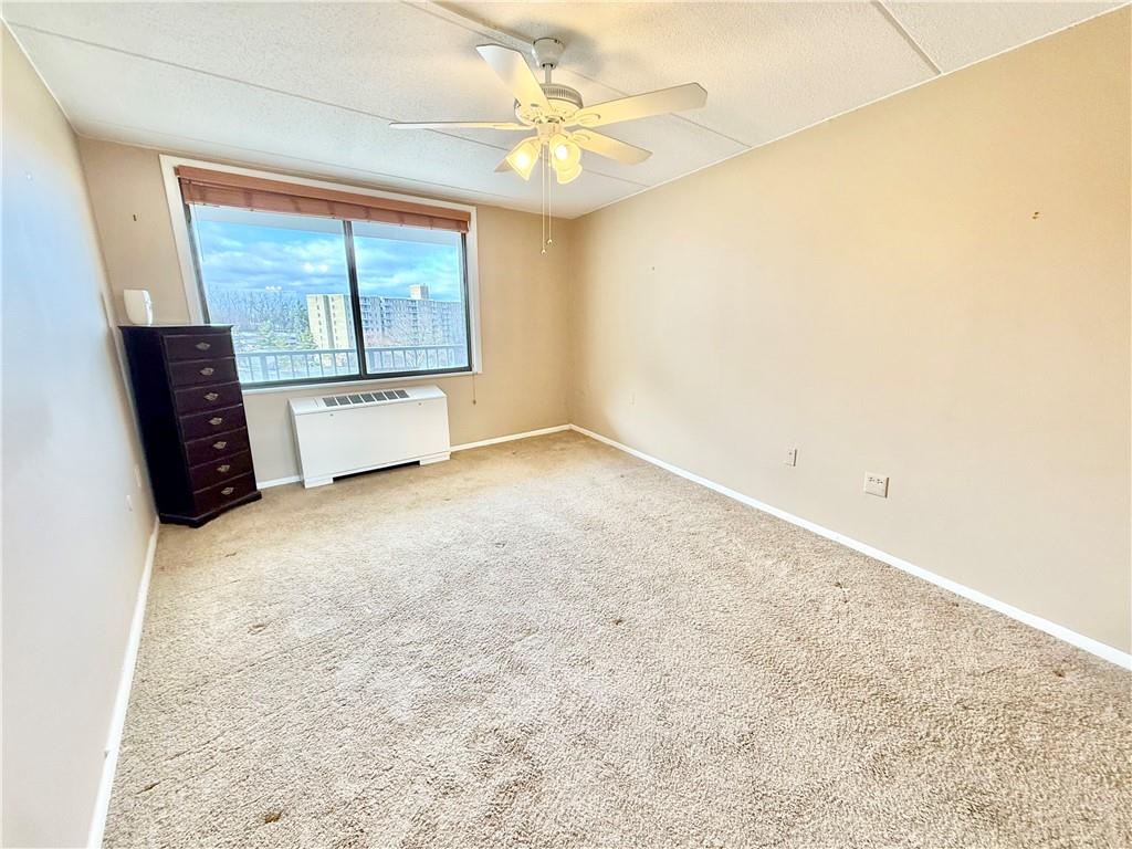 1160 Bower Hill Road, Unit 302C Mt. Lebanon, PA 15243 - Photo 28 of 39 an empty room with windows and fireplace