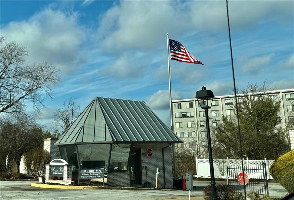 1160 Bower Hill Road, Unit 302C Mt. Lebanon, PA 15243 - Photo 3 of 39 a front view of a building with street view and trees