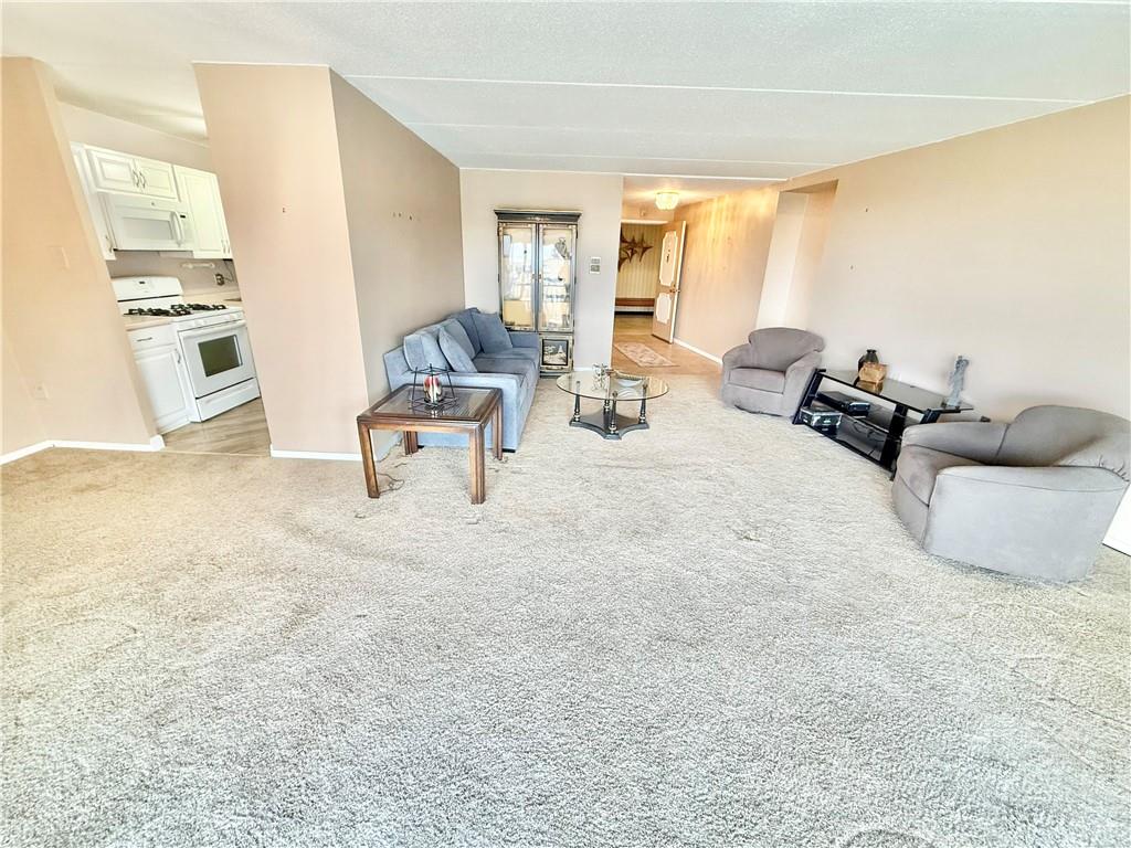 1160 Bower Hill Road, Unit 302C Mt. Lebanon, PA 15243 - Photo 10 of 39 a living room with furniture and a large window
