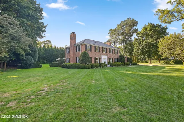 a view of a house with a big yard