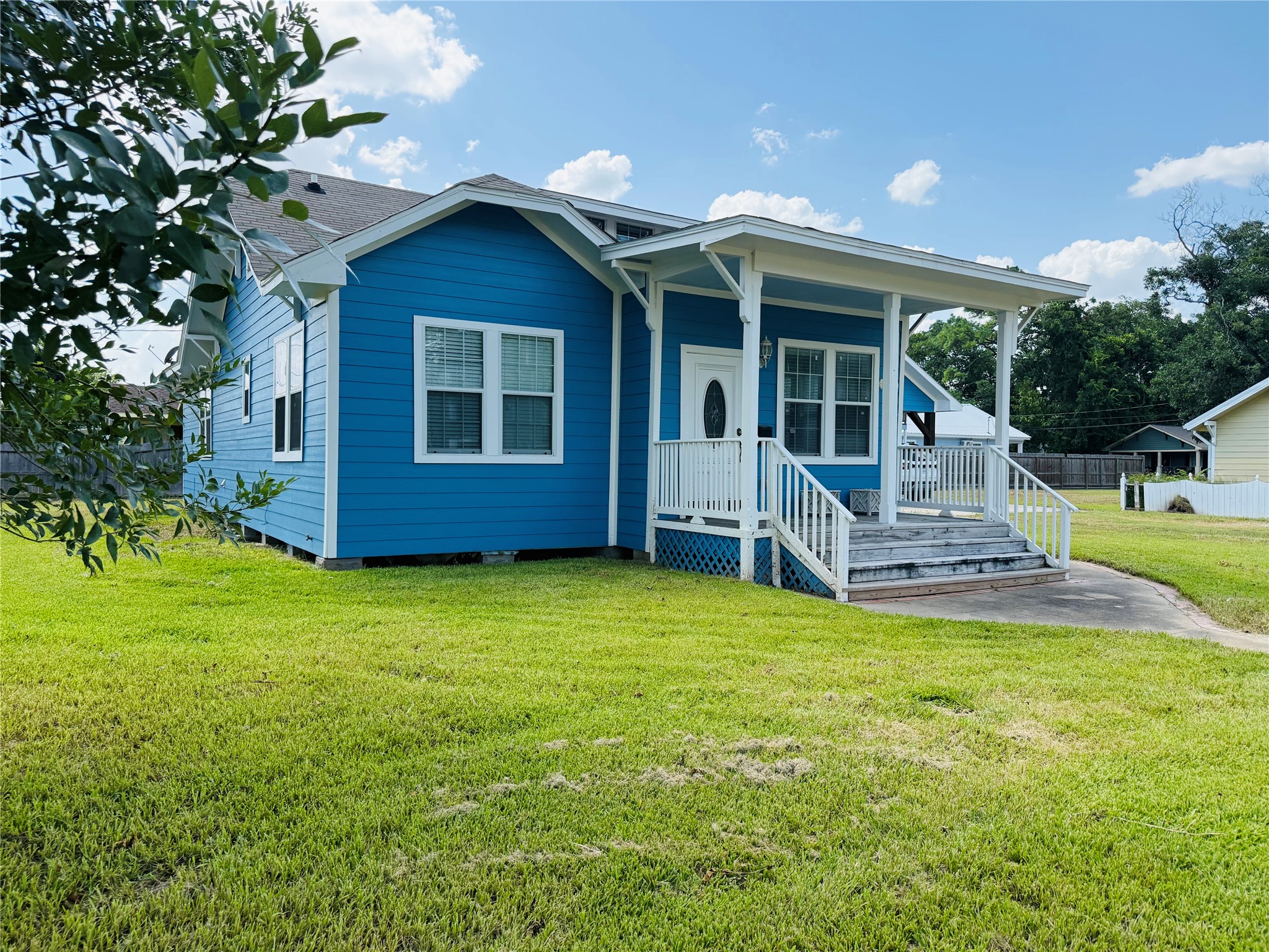 a front view of house with yard and porch