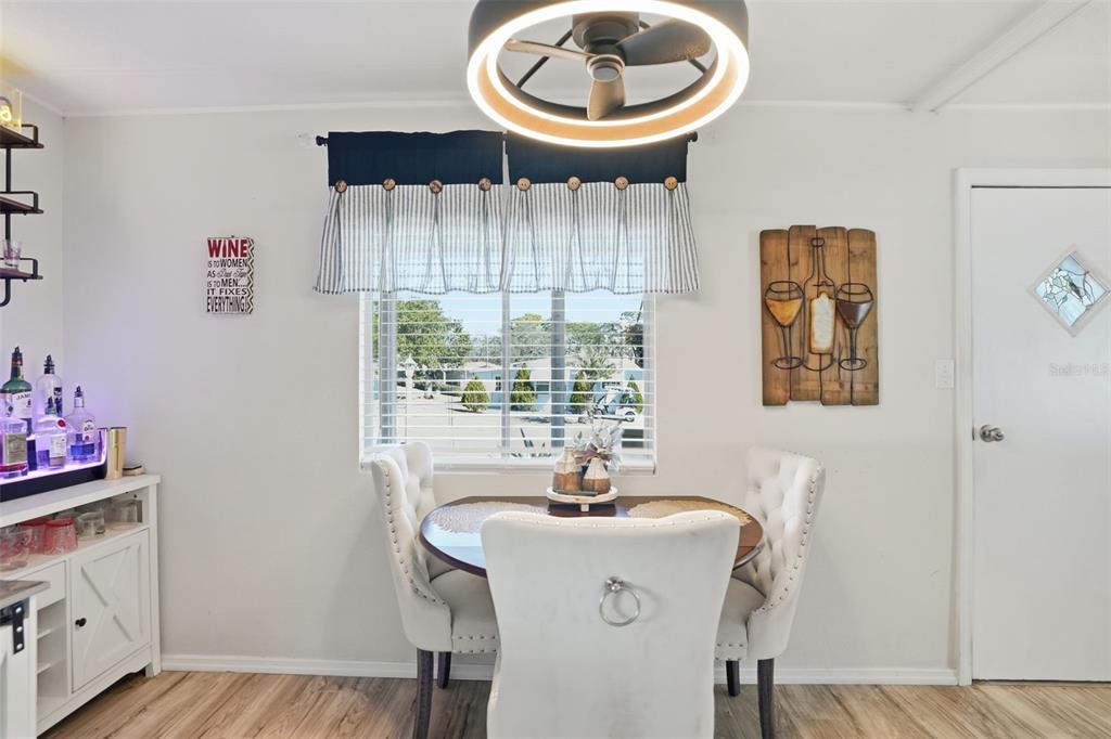 8055 Country Club Drive Brooksville, FL 34613 - Photo 17 of 33 a dining room with furniture and a window