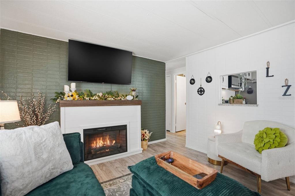 8055 Country Club Drive Brooksville, FL 34613 - Photo 19 of 33 a living room with furniture and a fireplace
