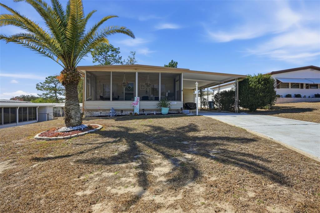 8055 Country Club Drive Brooksville, FL 34613 - Photo 2 of 33 a front view of a house with a yard
